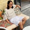 white linen shorts with pleats